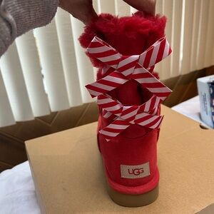UGG Red Boots with Candy Cane Bows
Never worn.